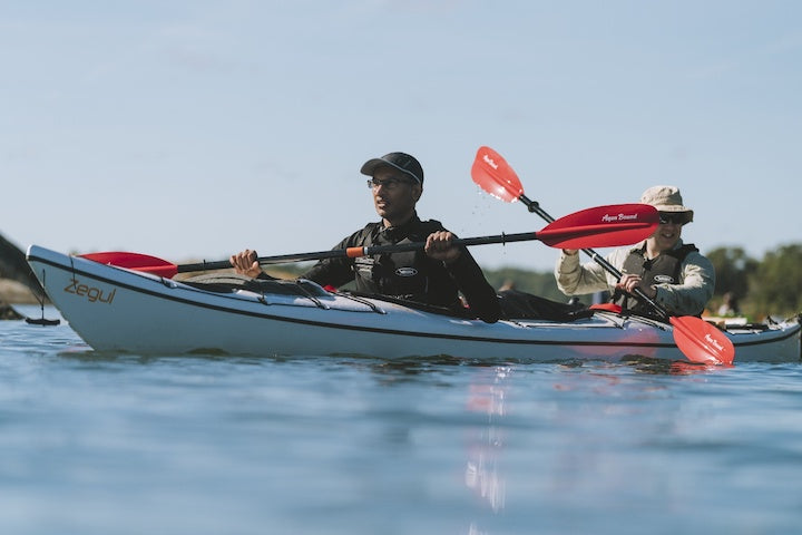 two men kayaking in a tandem kayak
