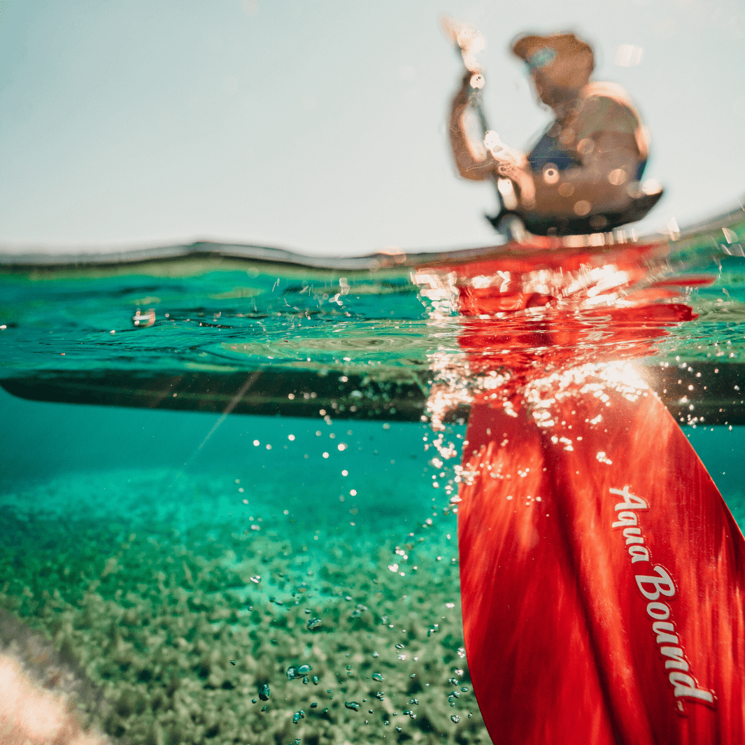 manta ray fiberglass 4-piece snap button sunset red partially underwater man above water line partially blurred#color_sunset-red