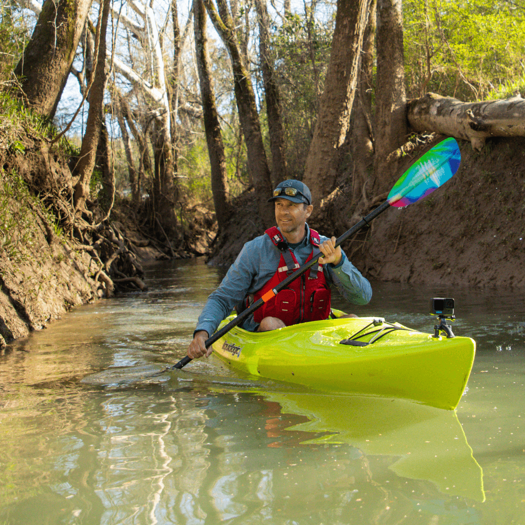 tango fiberglass 4-piece posi-lok kayak paddle northern lights  being paddled by Ken Whiting in yellow kayak#color_northern-lights